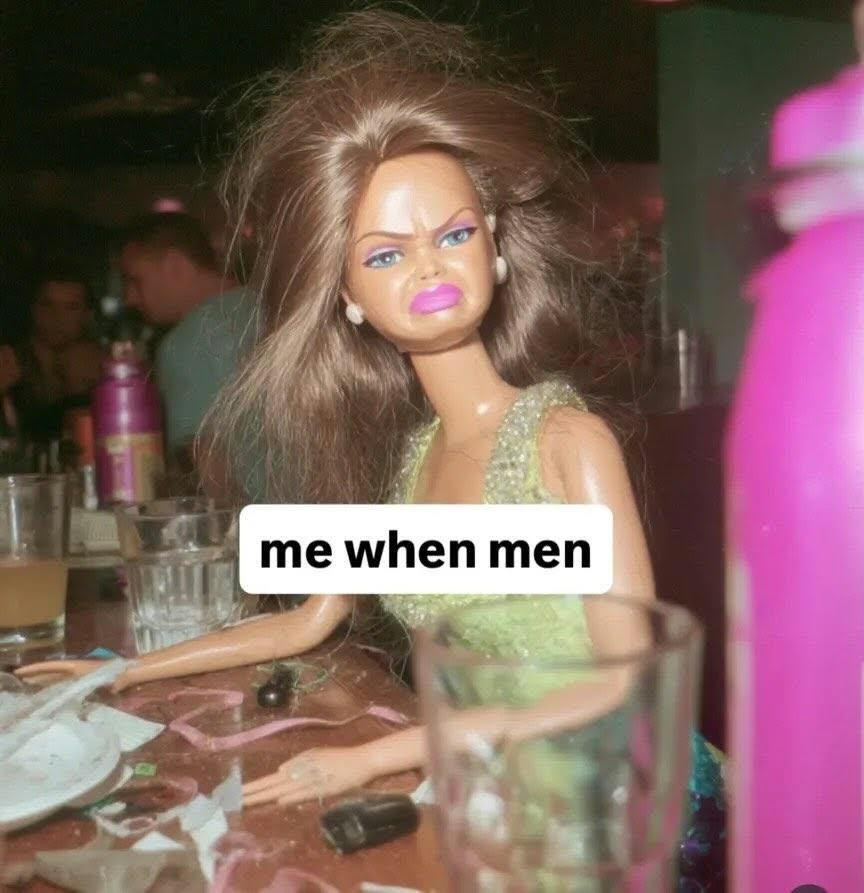 A scowling brunette Barbie slumped at a messy bar table, captioned 'me when men'